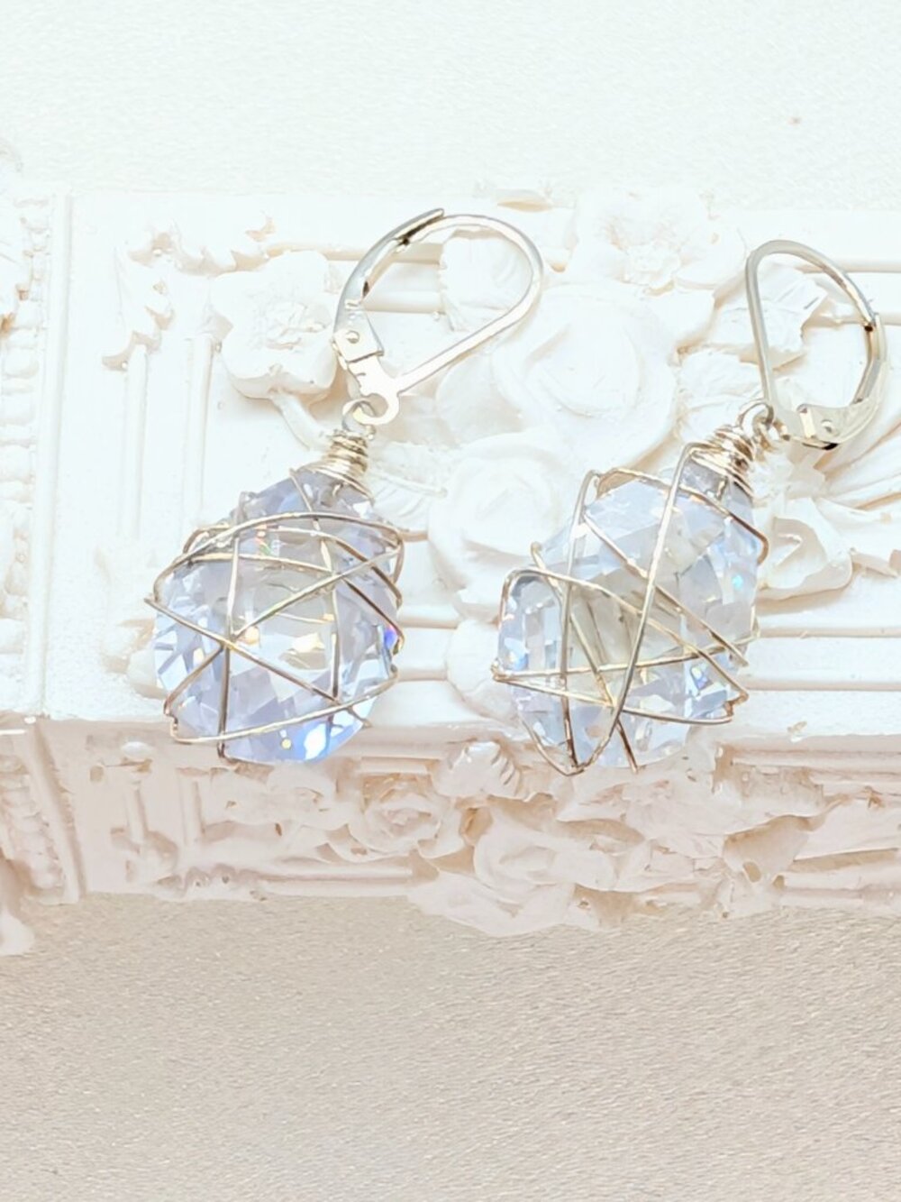 New fancy encased 925 and clear CZ drop earrings by Designer Nina Nyugen
